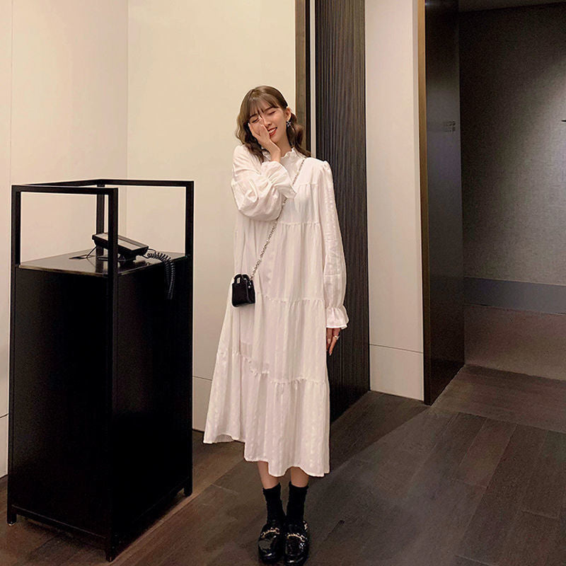 Ruffled Dress With High Neck And Flare Sleeves