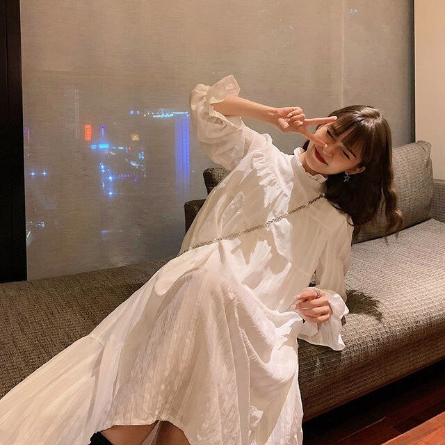 Ruffled Dress With High Neck And Flare Sleeves