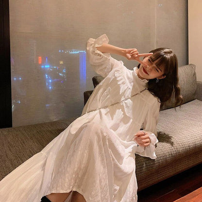 Ruffled Dress With High Neck And Flare Sleeves