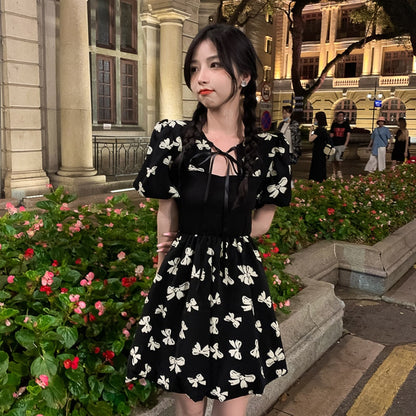 Two-Colored Dress With Bow Print And Ribbon