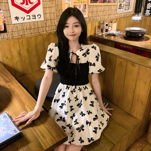 Two-Colored Dress With Bow Print And Ribbon