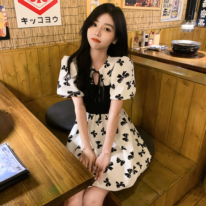 Two-Colored Dress With Bow Print And Ribbon