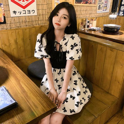 Two-Colored Dress With Bow Print And Ribbon
